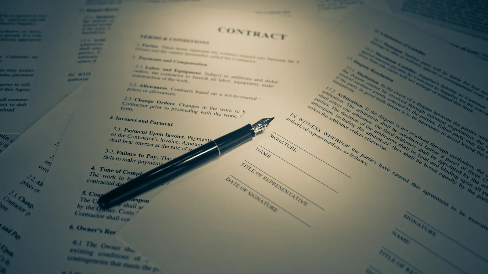 Printed contract pages with signature lines and a fountain pen, the paperwork document management software replaces