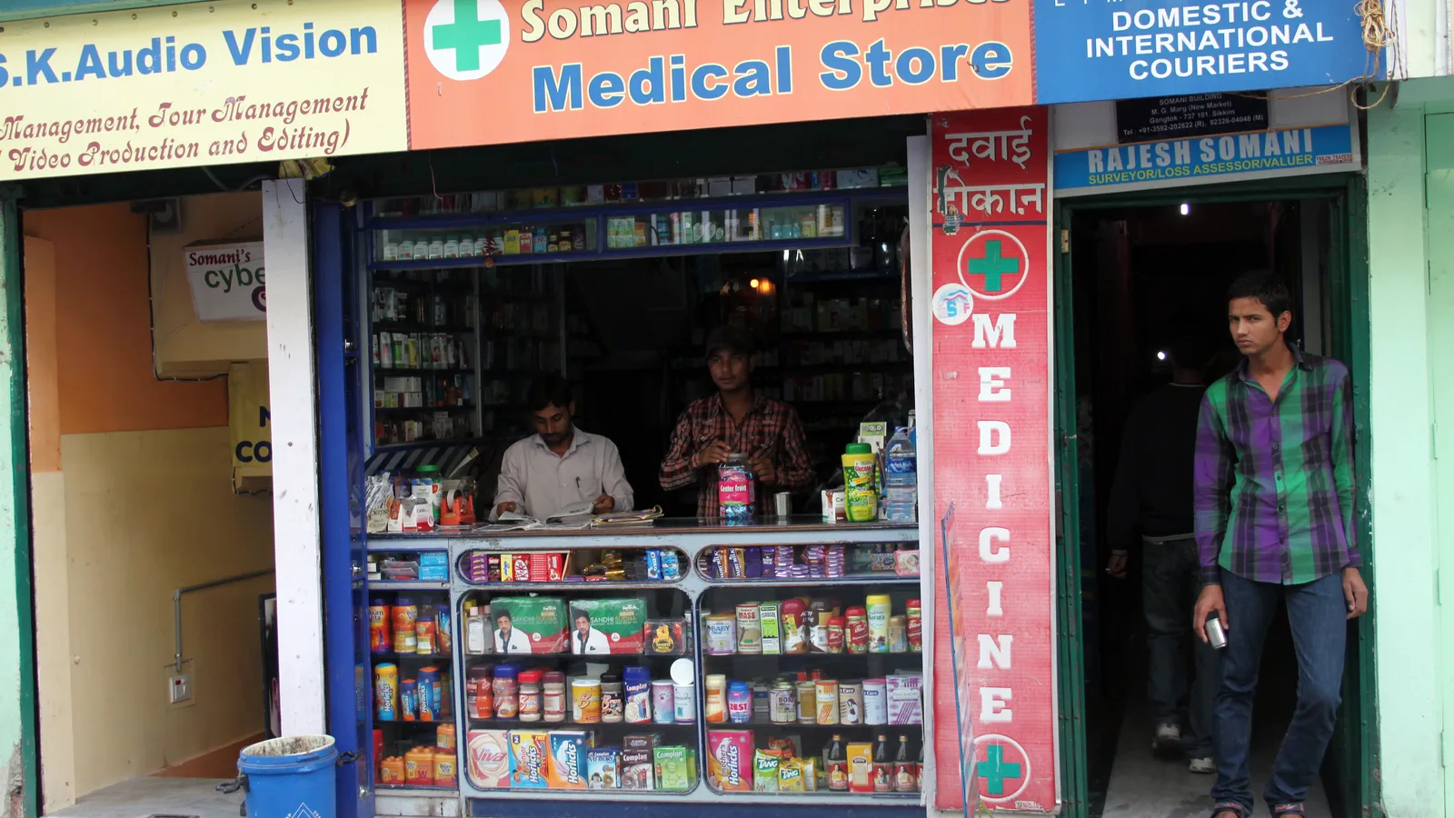 Front of a small medical store in Gangtok with medicines on shelves and staff at the counter