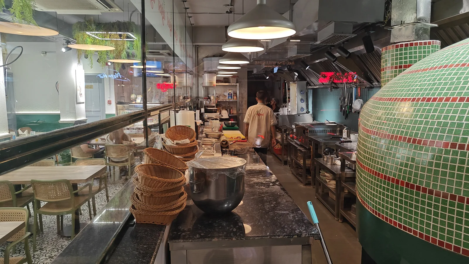 Open kitchen and service counter of a restaurant in Lajpat Nagar, Delhi