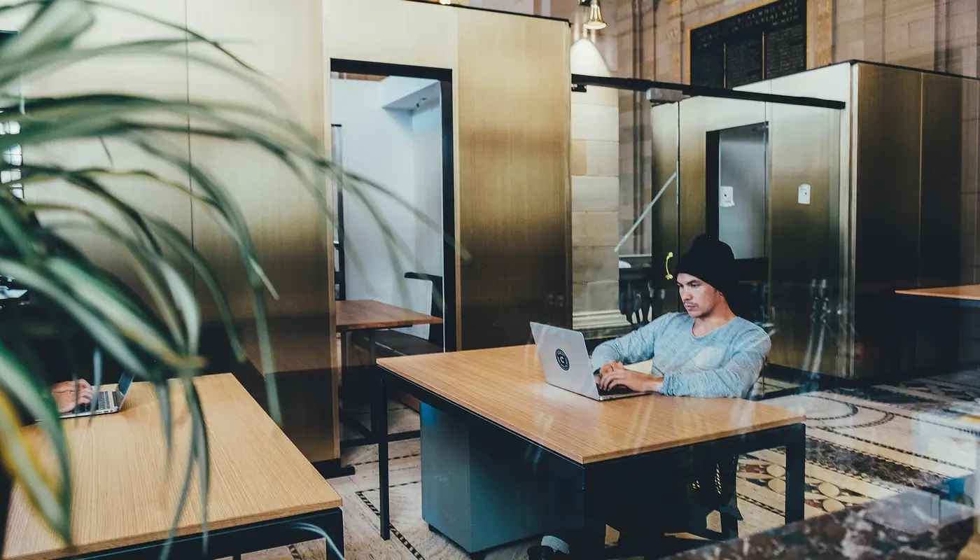 Freelancer creating a GST invoice for a client on a laptop